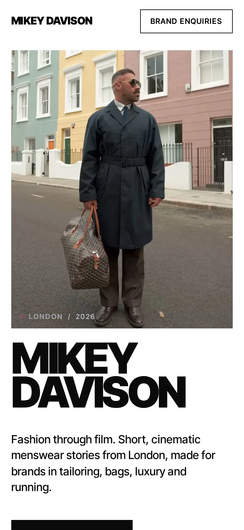 Design concept for Mikey Davison, huge black name type beside a photo of him in a navy trench coat on a London street